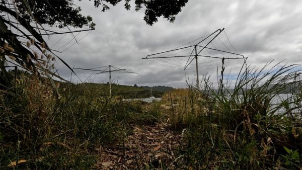 This image shows three rotary washing lines near the shore where sailors can hang their clothes up to dry after washing them. The washing lines are empty ready to be used.